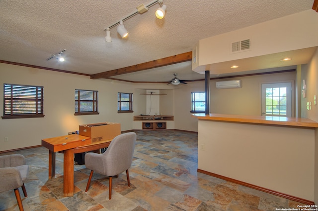 dining space featuring track lighting, tile flooring, ceiling fan, and a textured ceiling