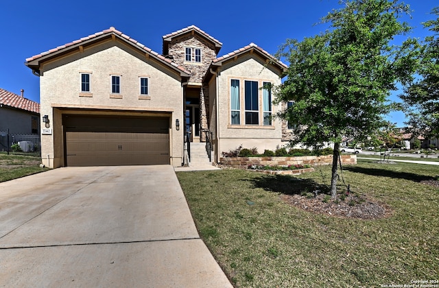 view of front of house featuring a front lawn and a garage