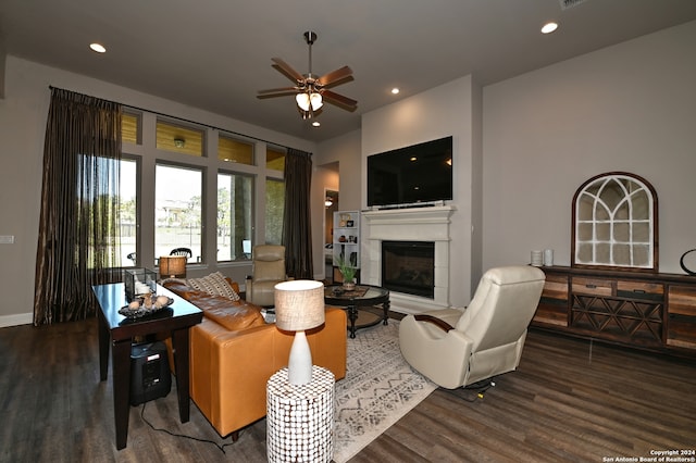 living room featuring dark hardwood / wood-style floors and ceiling fan