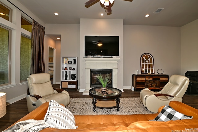 living room featuring dark hardwood / wood-style flooring and ceiling fan