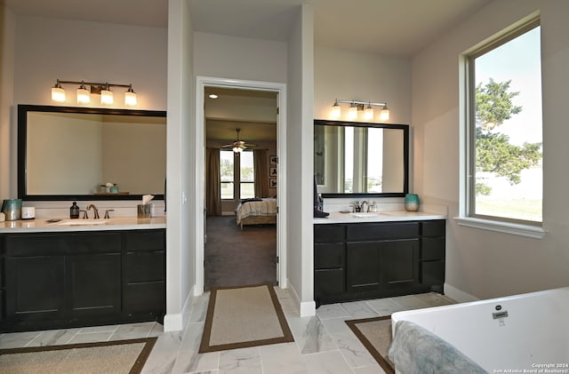 bathroom with ceiling fan, tile floors, a healthy amount of sunlight, and vanity