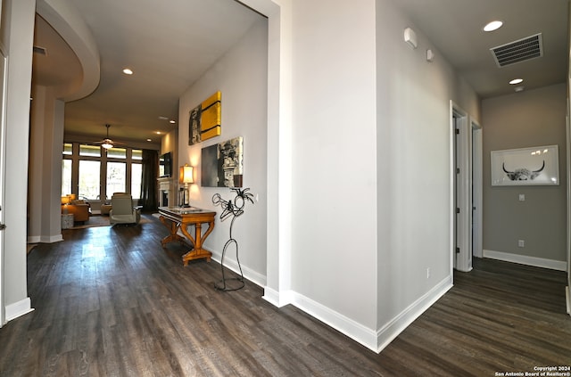 hall with dark hardwood / wood-style flooring