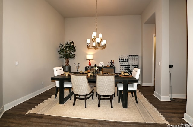 dining space featuring an inviting chandelier and dark hardwood / wood-style floors