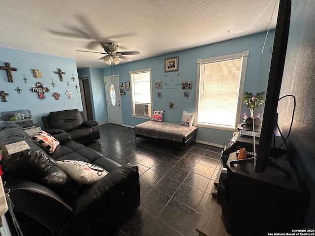 tiled living room with ceiling fan