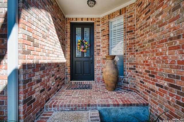 view of exterior entry featuring a porch