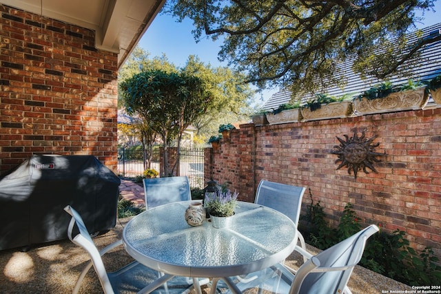 view of terrace featuring a grill