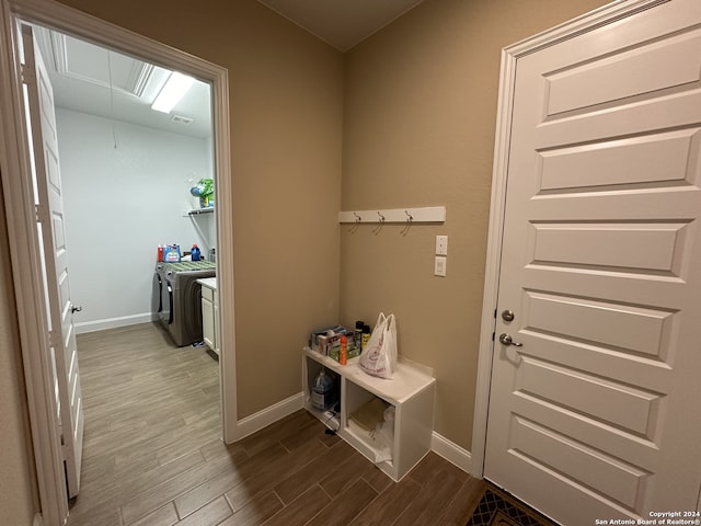 mudroom featuring washer and clothes dryer and wood-type flooring