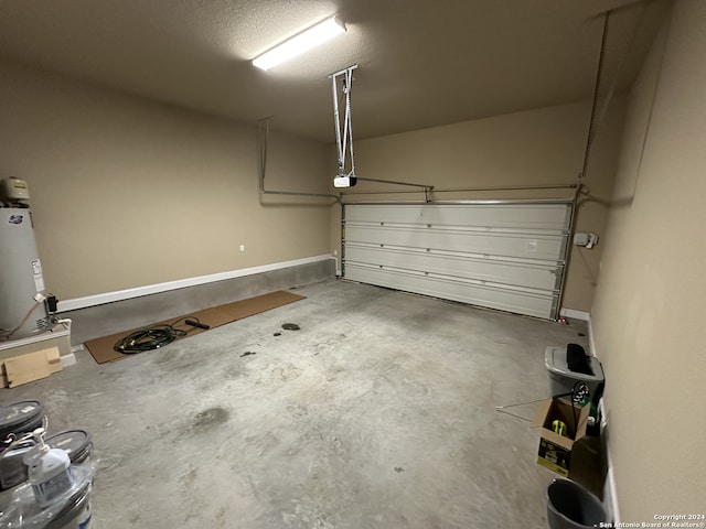 garage featuring a garage door opener and water heater