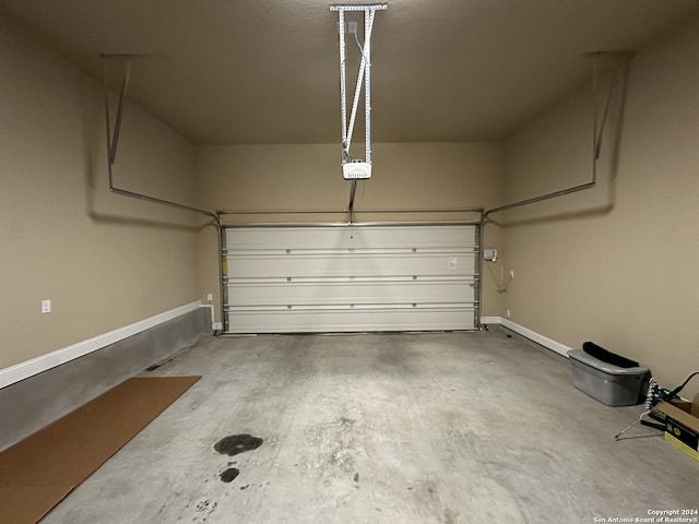 garage featuring a garage door opener