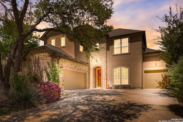 view of front of property with a garage