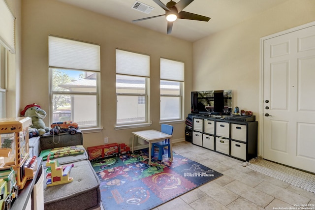 game room featuring ceiling fan and light tile flooring