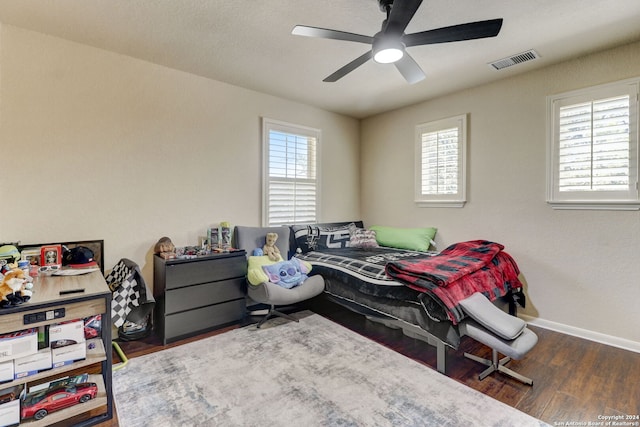 bedroom featuring ceiling fan and dark hardwood / wood-style flooring