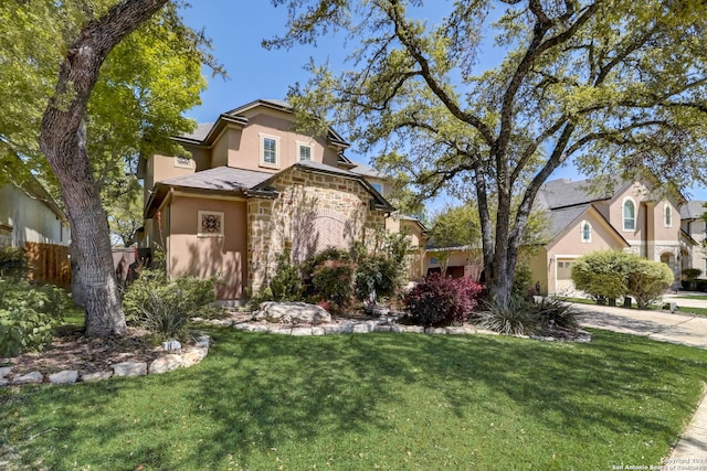 view of front of house with a front lawn and a garage