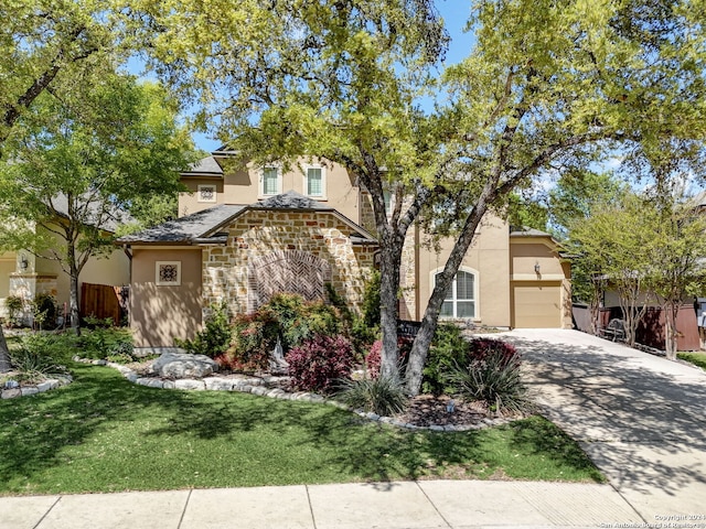 view of front of house featuring a front yard and a garage