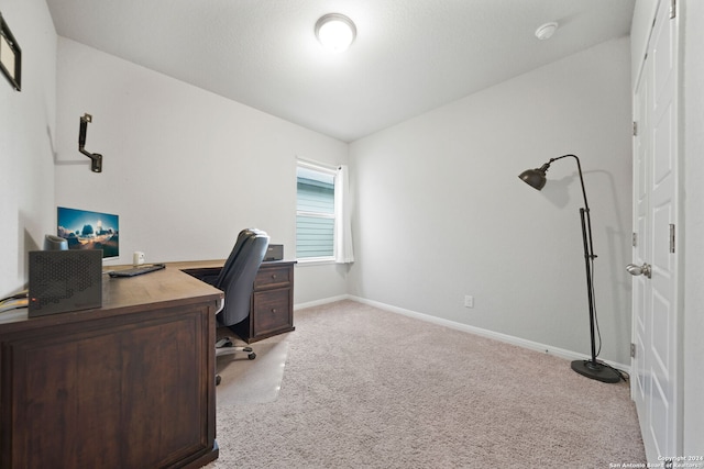 home office with light colored carpet and lofted ceiling