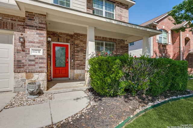 doorway to property featuring a porch