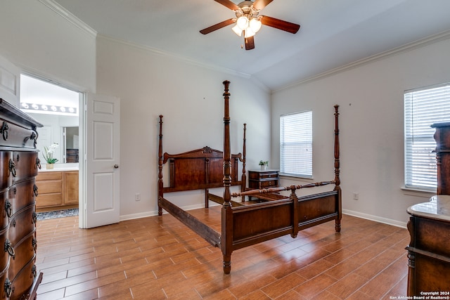 bedroom featuring ensuite bath, ornamental molding, ceiling fan, and lofted ceiling