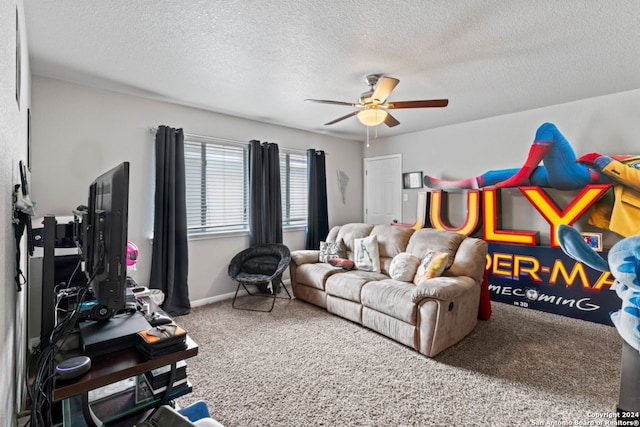 interior space featuring a textured ceiling, light colored carpet, and ceiling fan