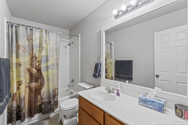 full bathroom with tile floors, a textured ceiling, toilet, shower / bath combo, and vanity