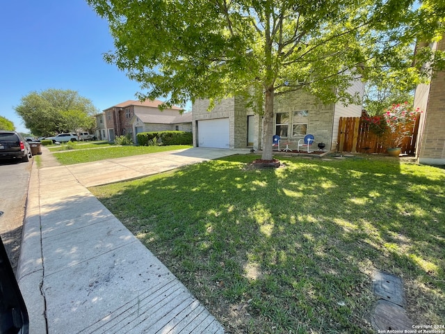 view of front facade with a front lawn and a garage