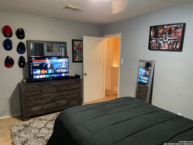 bedroom with light carpet