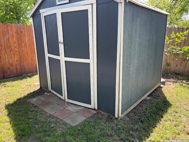 view of outdoor structure with a lawn