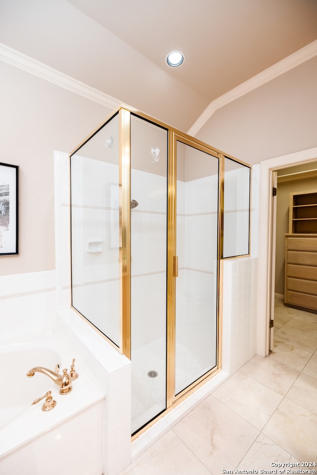 bathroom with tile flooring, independent shower and bath, and crown molding