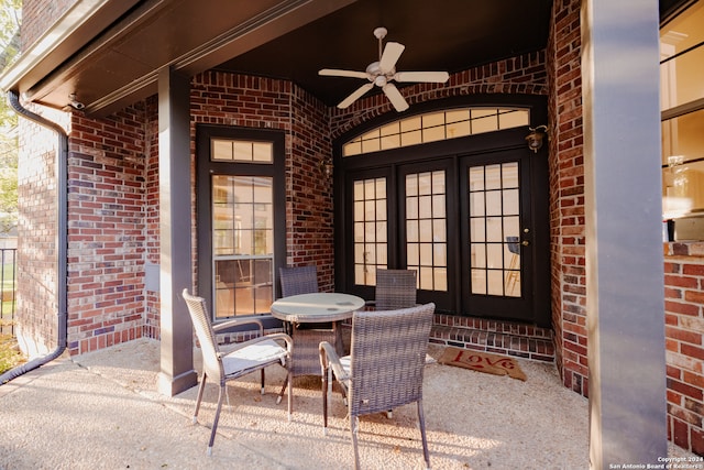 view of patio featuring ceiling fan and french doors