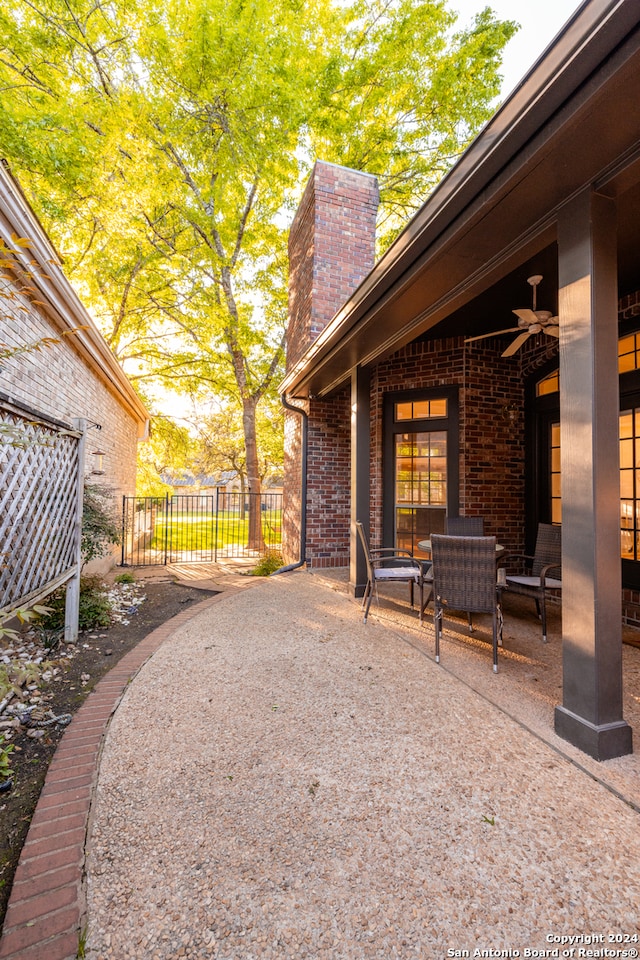 view of yard featuring ceiling fan and a patio area