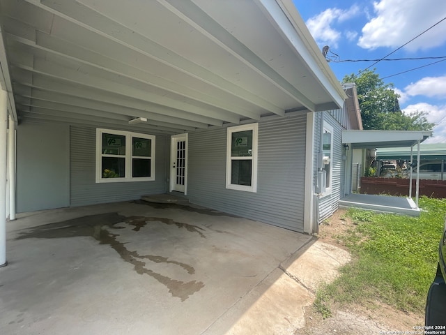 view of property exterior featuring a patio area