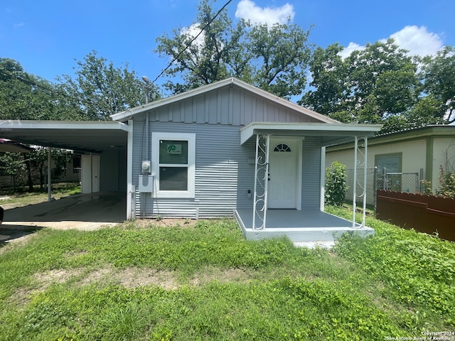 view of front of home featuring a carport