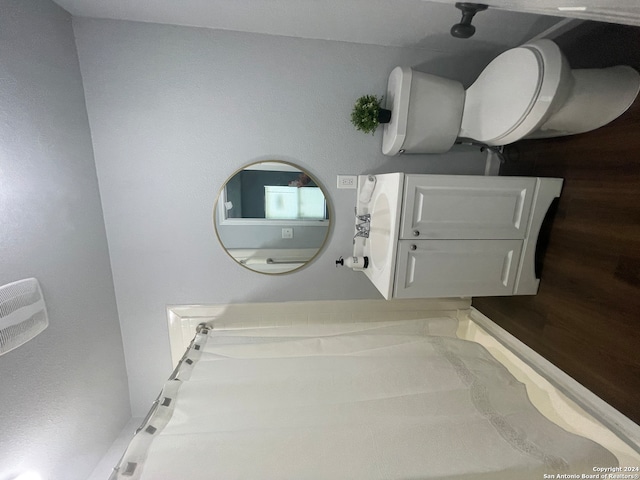 bathroom featuring toilet, vanity, and hardwood / wood-style flooring