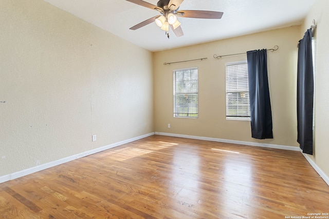 spare room featuring ceiling fan and light hardwood / wood-style floors