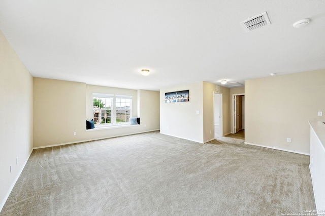 unfurnished room with light colored carpet