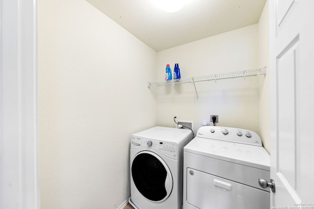 clothes washing area with electric dryer hookup, hookup for a washing machine, and washing machine and clothes dryer