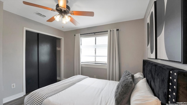 bedroom featuring a closet, wood-type flooring, and ceiling fan