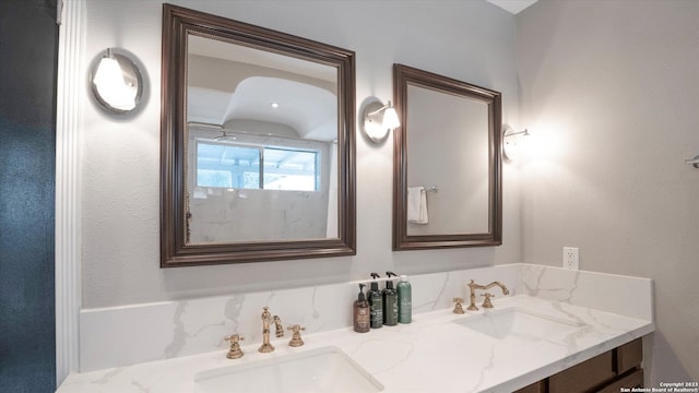 bathroom with double sink and oversized vanity