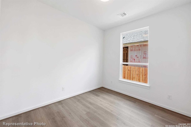 empty room featuring light hardwood / wood-style floors