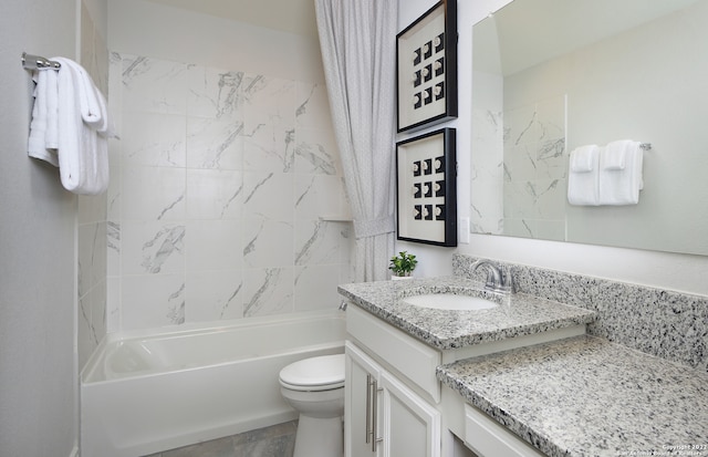 full bathroom featuring oversized vanity, toilet, and tiled shower / bath