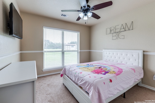 bedroom with light colored carpet and ceiling fan