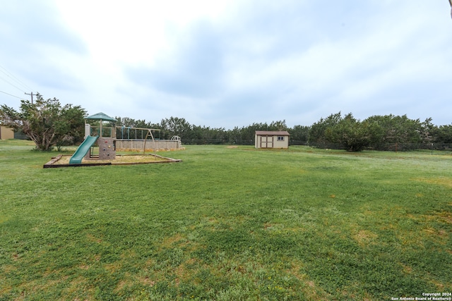 view of yard featuring a shed and a playground