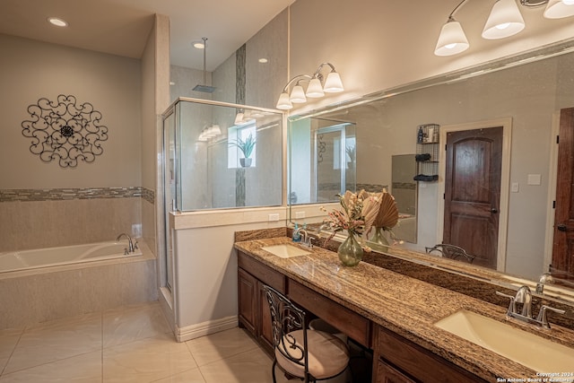 bathroom with independent shower and bath, dual bowl vanity, and tile flooring