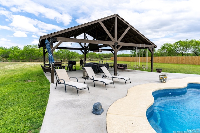 view of pool with a gazebo, a yard, and a patio area