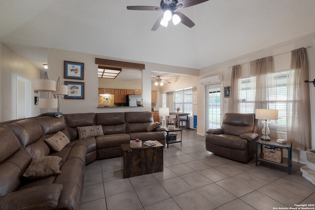 tiled living room featuring ceiling fan and a wall mounted AC