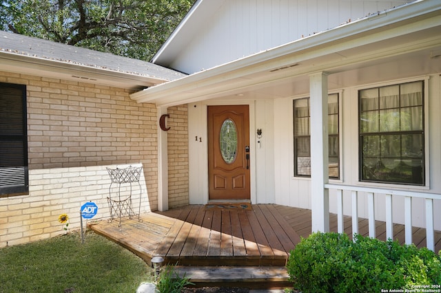 entrance to property featuring a deck