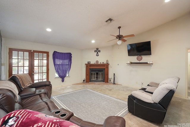 living room featuring french doors, ceiling fan, and vaulted ceiling