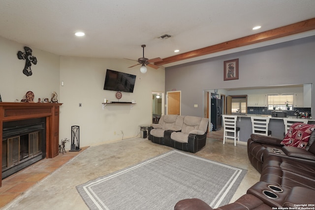 living room with beamed ceiling and ceiling fan