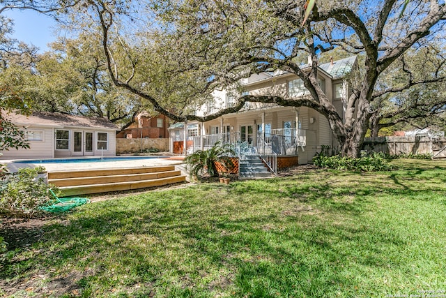 view of yard with a pool side deck