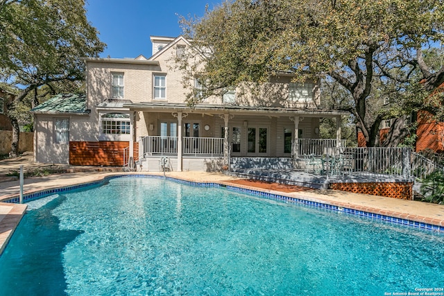 view of swimming pool with a patio area