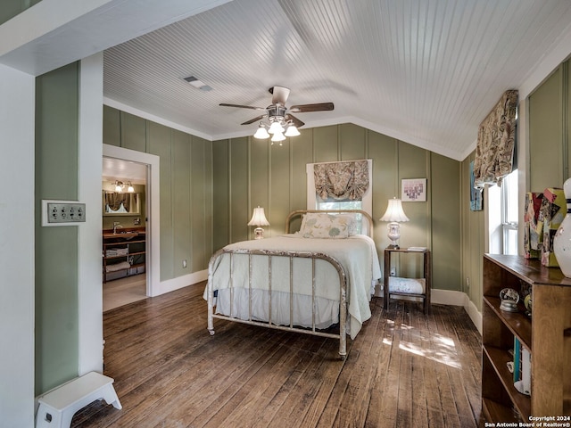 bedroom with ceiling fan, ornamental molding, dark wood-type flooring, and vaulted ceiling